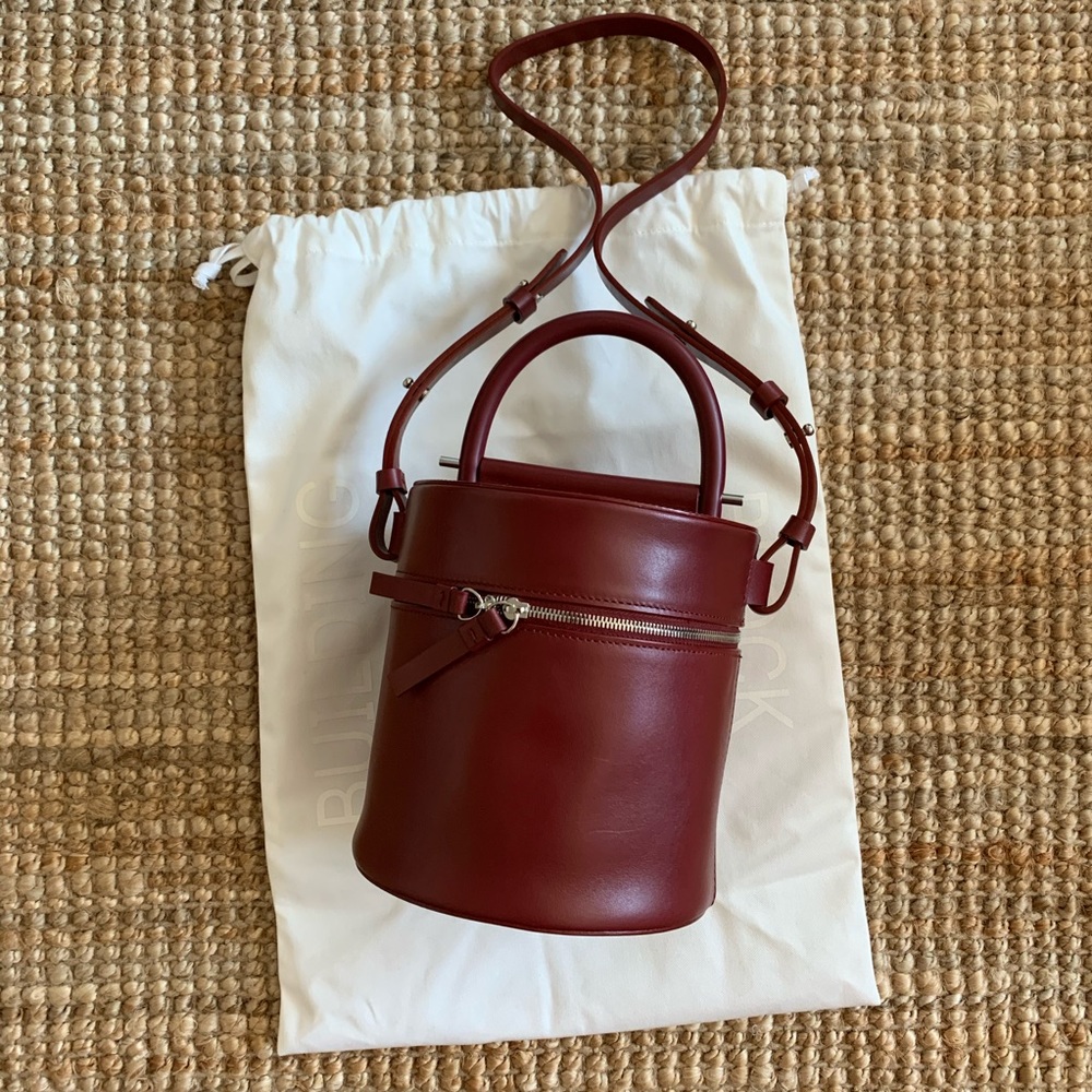 Building block maroon cylinder bag